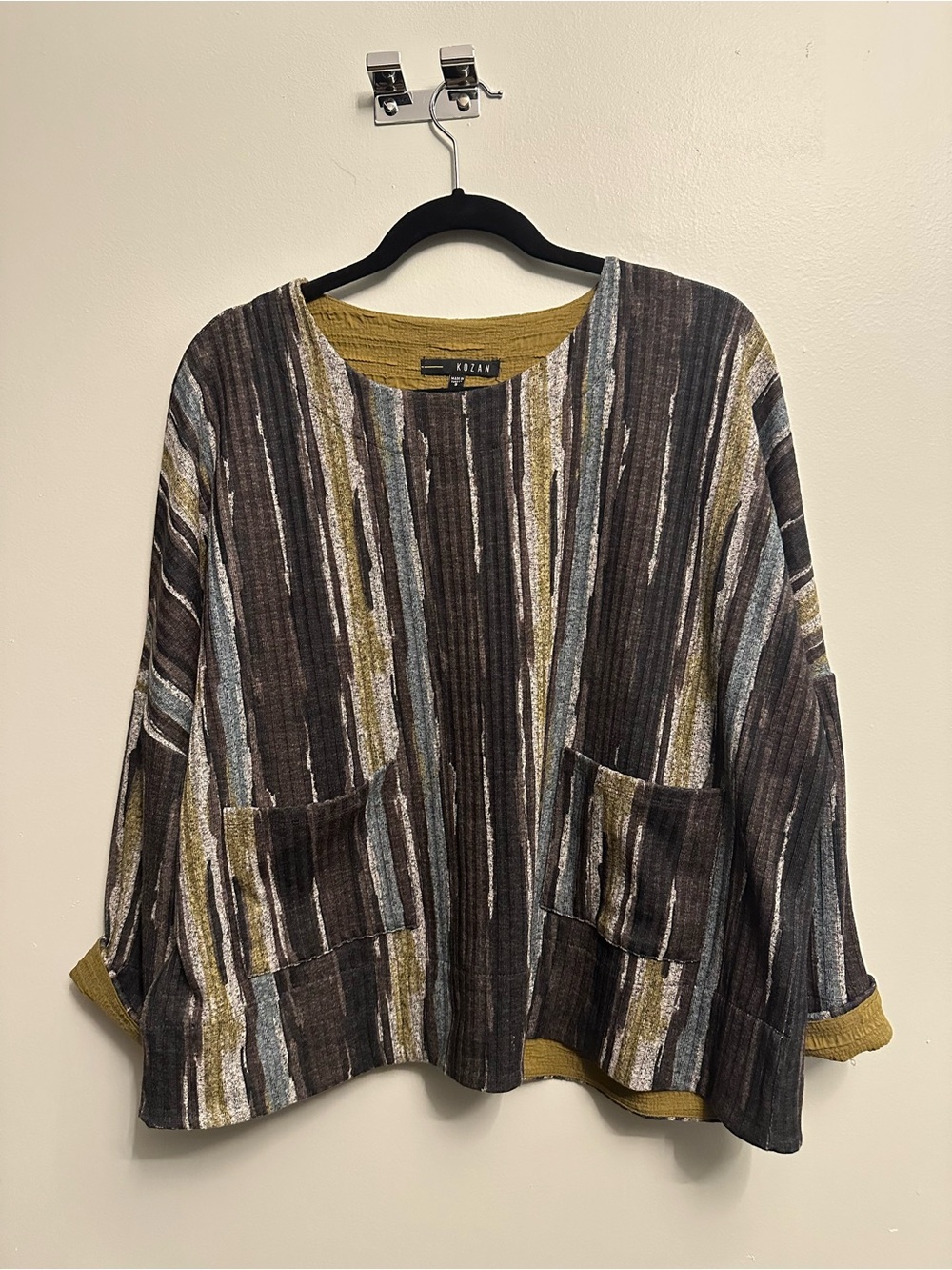 Kozan Striped Relaxed Pocket Top in Brown, Black, Cream, Blue and Olive.
